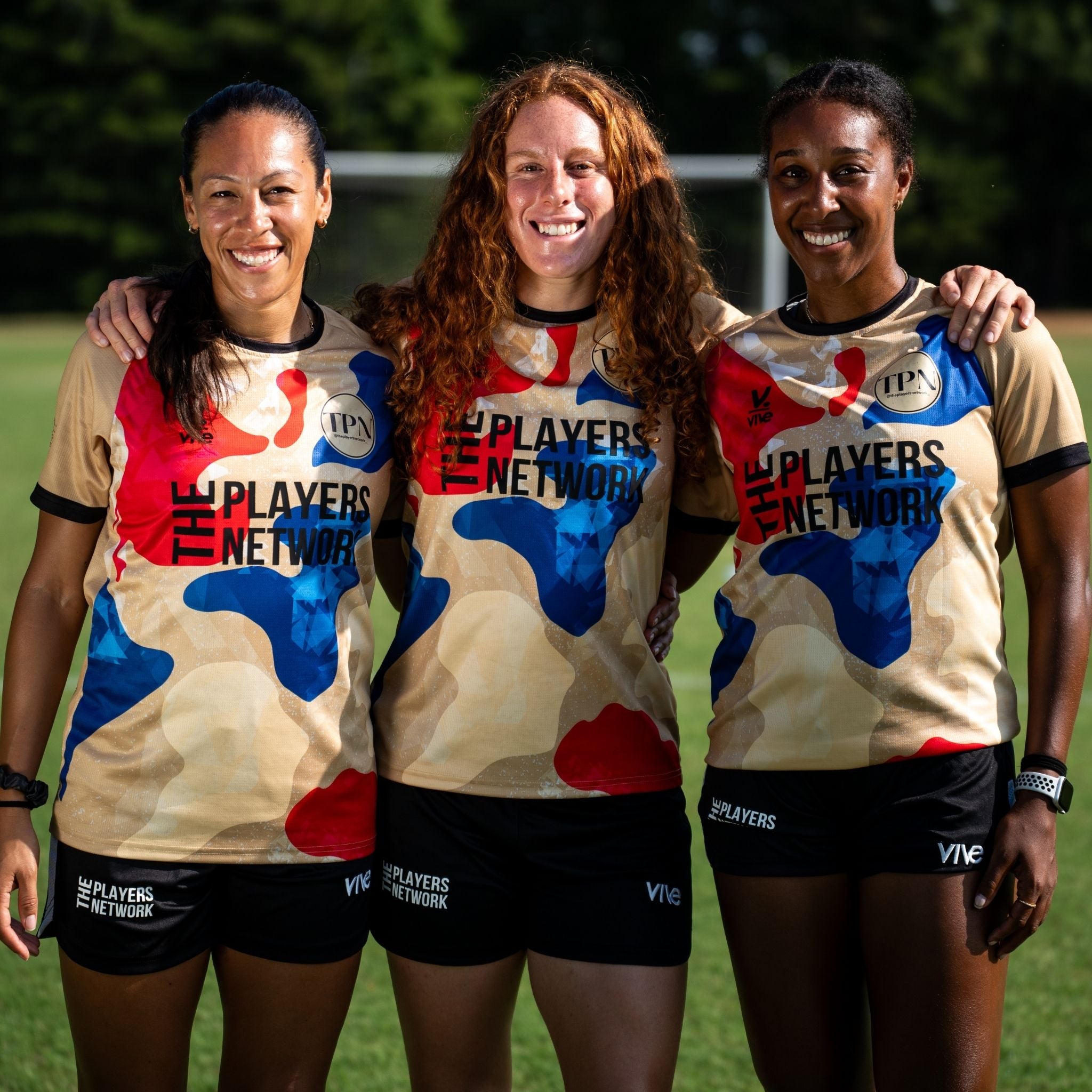 three girls in jerseys 