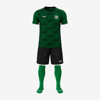 green jersey with black shorts and green socks