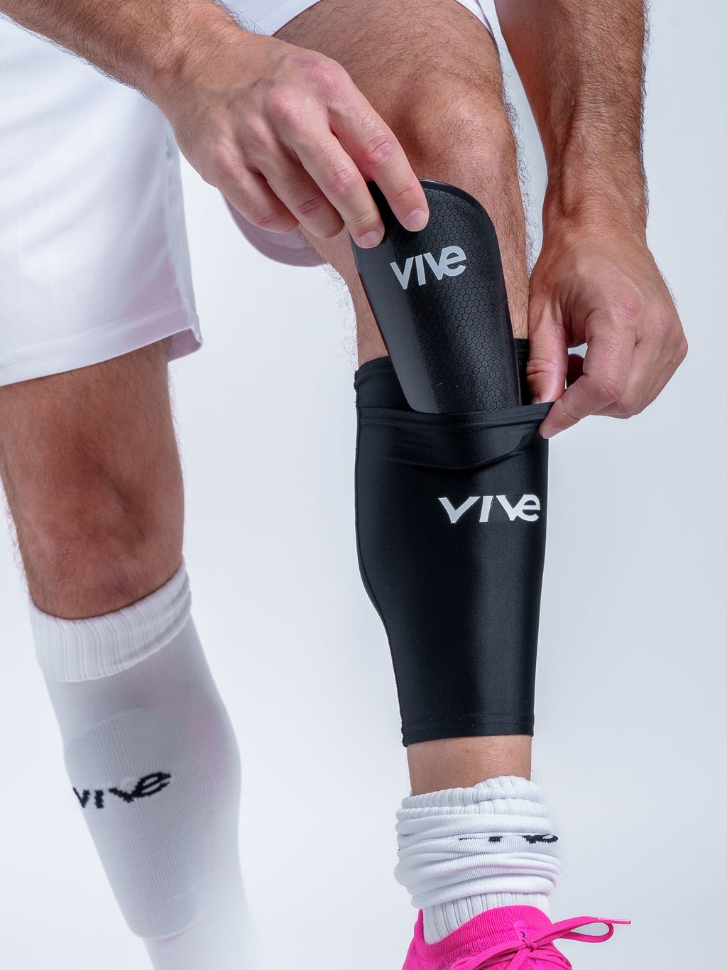 Victory Soccer Shin Guards on Model Sleeve View - Black color with White design from VIVE