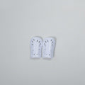 VIVE Create Future white soccer shin guards with perforated design for ventilation and impact absorption.