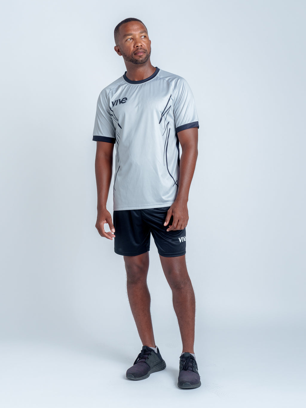 Espejo Soccer Training Jersey on Model Full Body - Grey color with Black design from VIVE