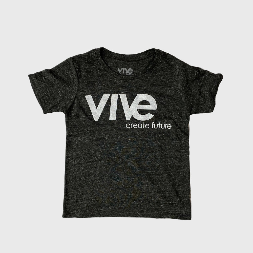 Black t-shirt with 'Vive create future' text on a brick wall background
