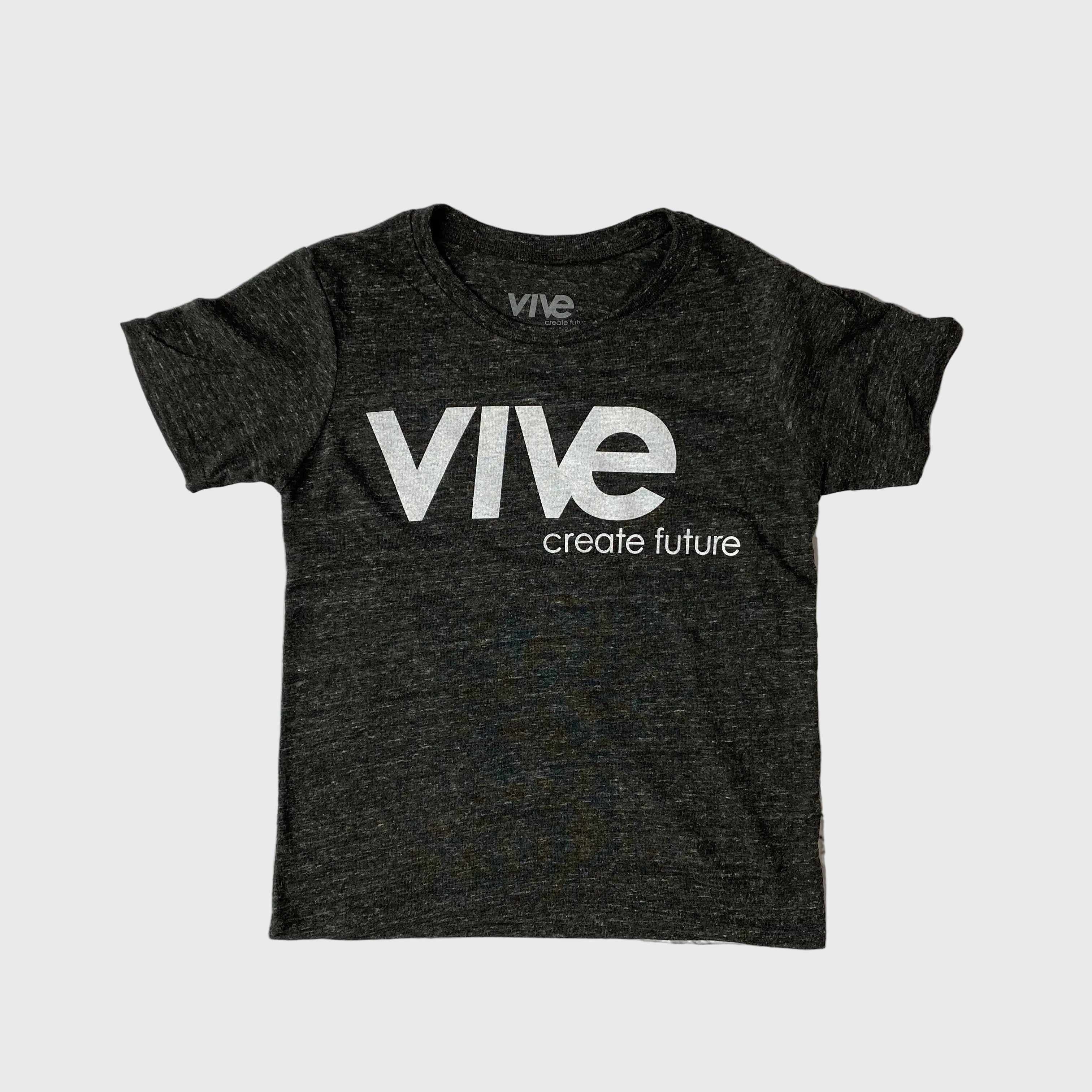 Black t-shirt with 'Vive create future' text on a brick wall background