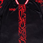 Arbol Soccer Training Jersey close up front view - Black color with Red design from VIVE