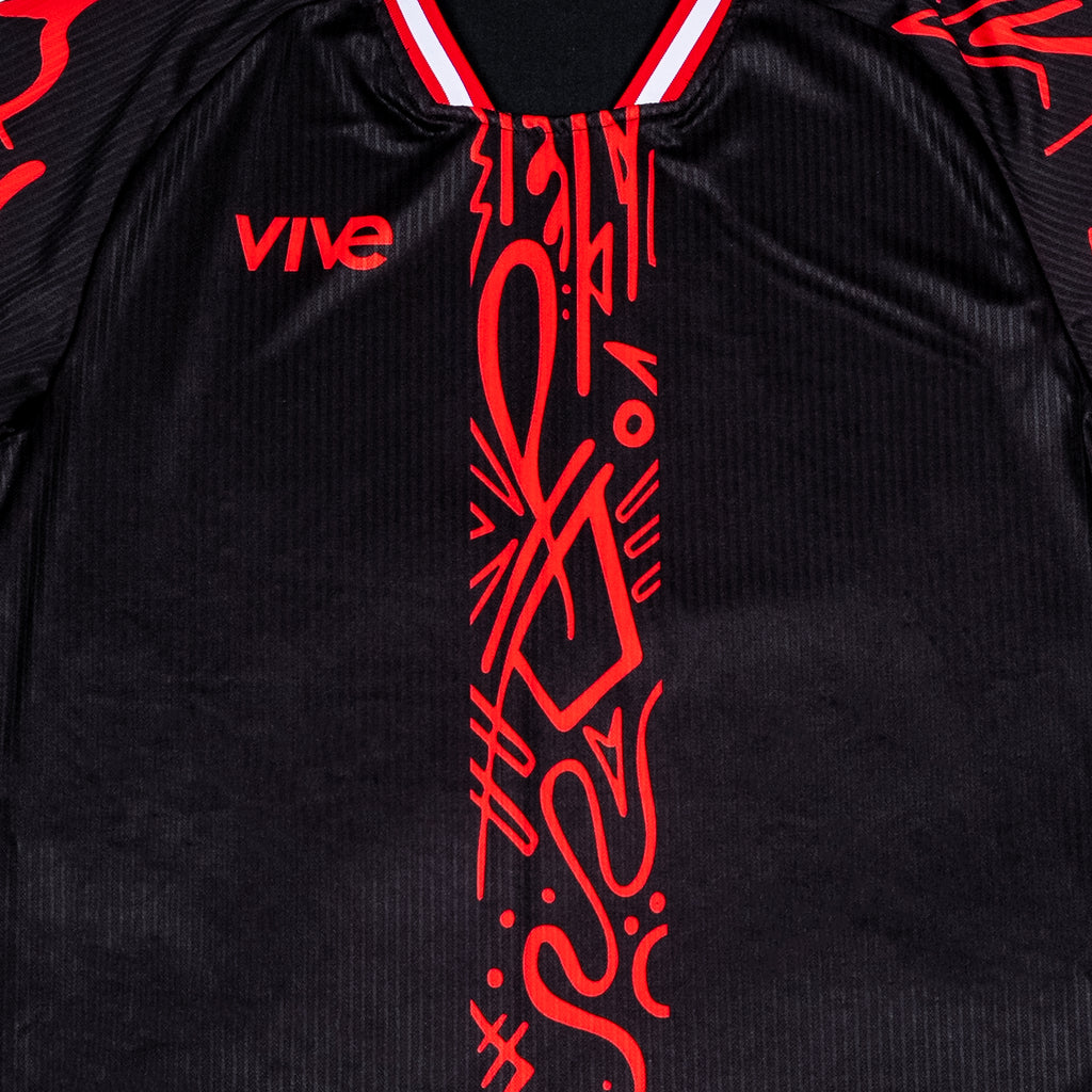 Arbol Soccer Training Jersey close up front view - Black color with Red design from VIVE