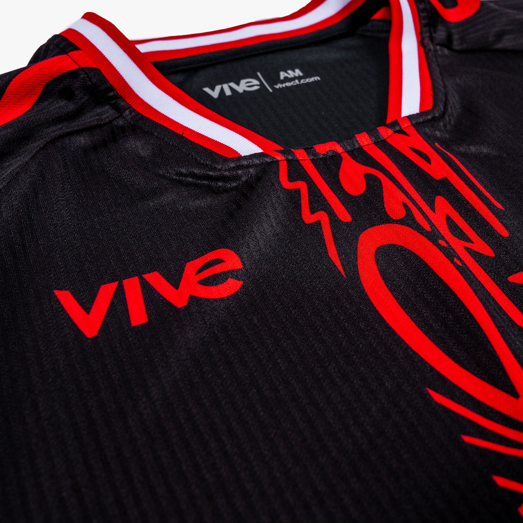 Arbol Soccer Training Jersey close up side view - Black color with Red design from VIVE