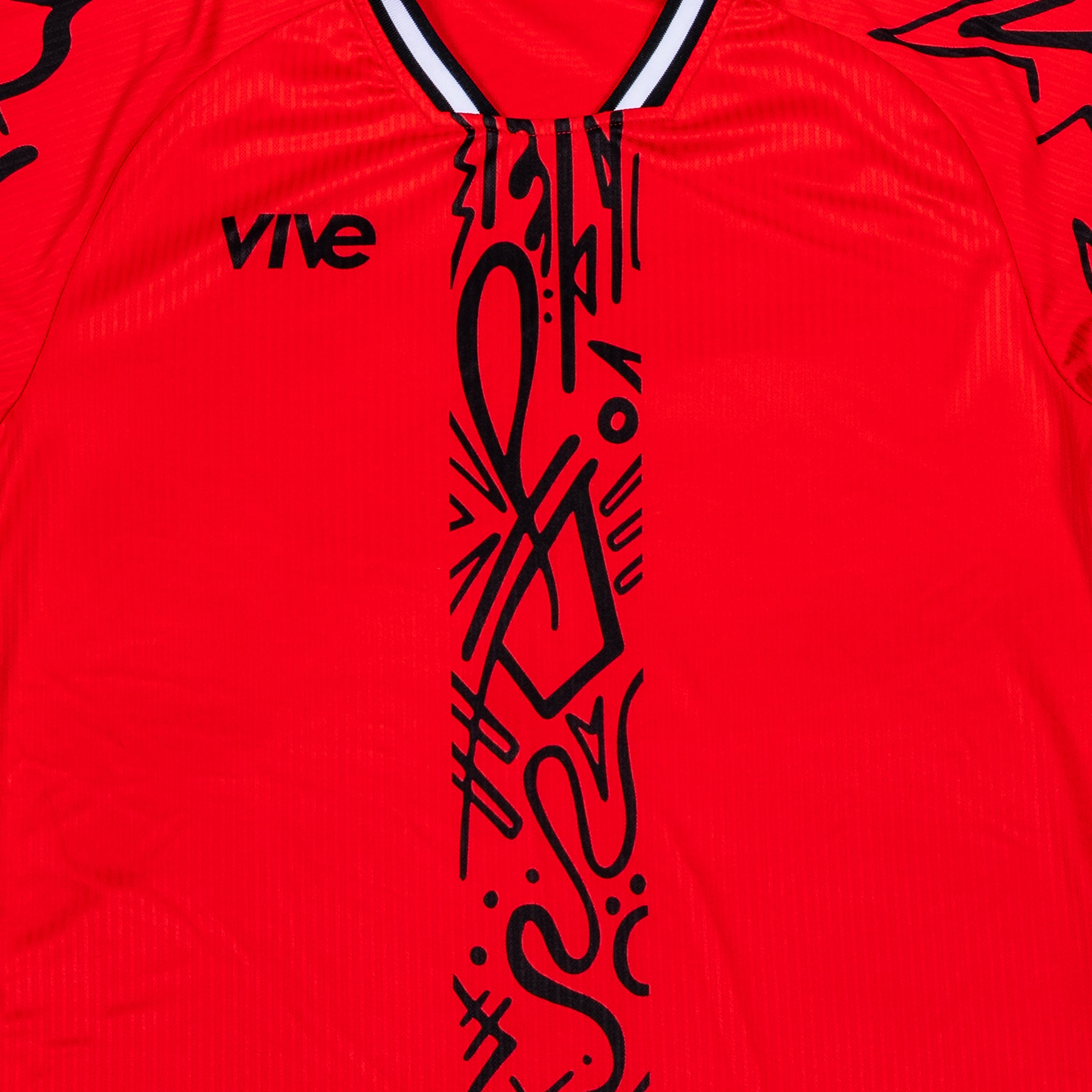 Arbol Soccer Training Jersey close up front view - Red color with Black design from VIVE