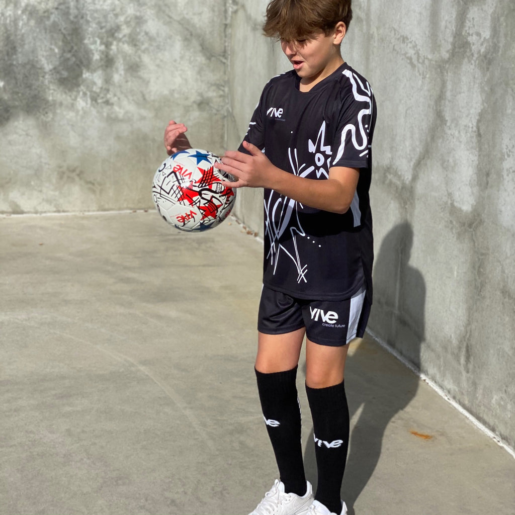 Grafico Size 4 Soccer Ball on the street - White color with black artwork and red and blue stars from Vive