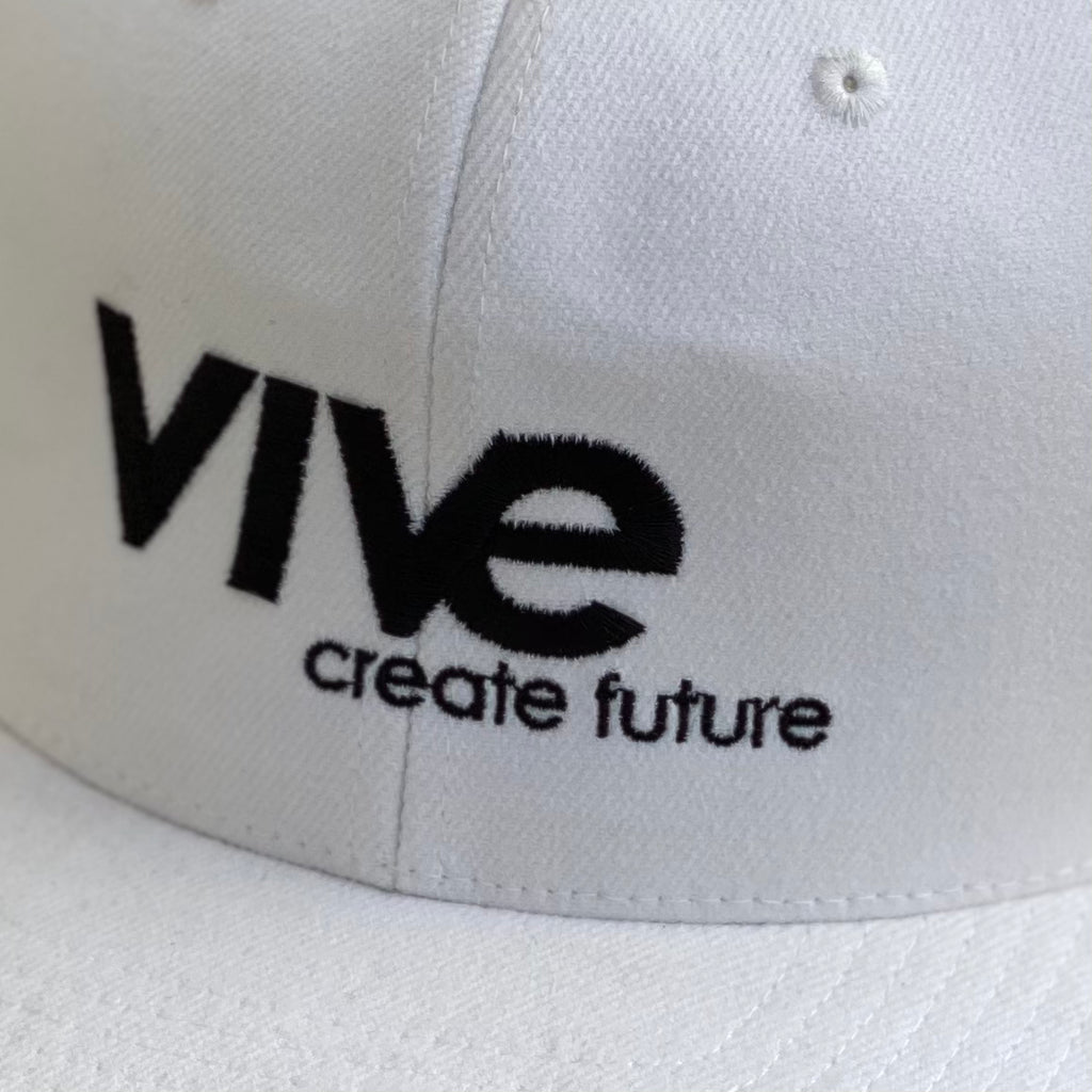 Logo Snapback Hat close up view - White with Black lettering from VIVE